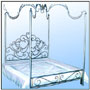 A designer hot forged wrought iron four poster curvilinear canopy and a simple foot board.  Sizes:  W : 6'  Center Height Canopy : 7'  WT : 106 lbs (Bed Head)